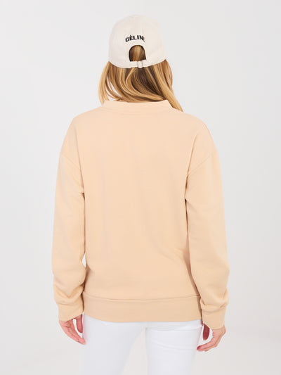 Beżowa bluza oversize z ozdobną naszywką