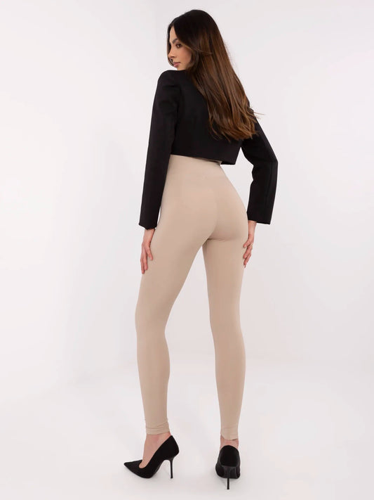 Beżowe damskie legginsy z ozdobną naszywką