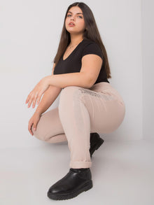 Beżowe spodnie dresowe plus size z dżetami