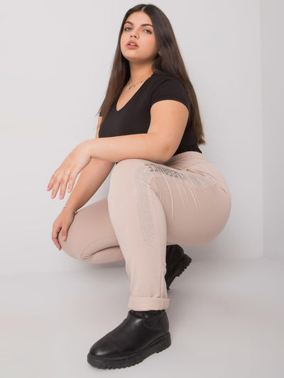 Beżowe spodnie dresowe plus size z dżetami