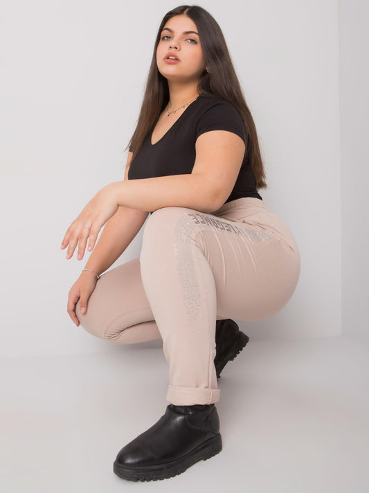 Beżowe spodnie dresowe plus size z dżetami