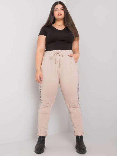 Beżowe spodnie dresowe plus size z dżetami