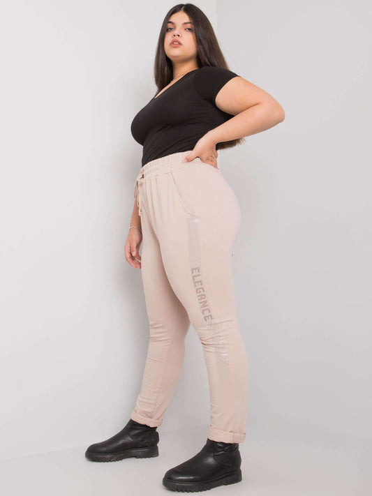Beżowe spodnie dresowe plus size z dżetami