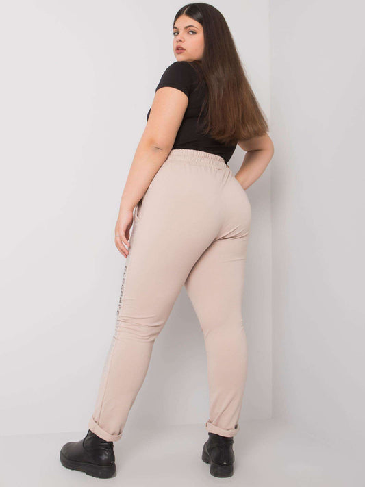 Beżowe spodnie dresowe plus size z dżetami