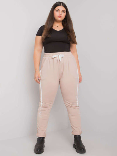 Beżowe spodnie dresowe plus size z printem