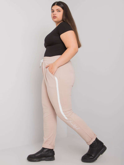 Beżowe spodnie dresowe plus size z printem
