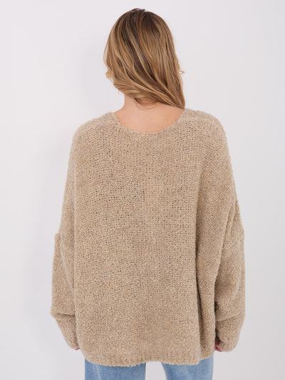 Beżowy sweter boucle o kroju oversize