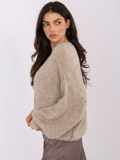 Beżowy sweter oversize w jednolitym kolorze