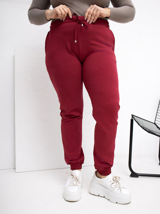 Bordowe dresowe spodnie plus size z kieszeniami