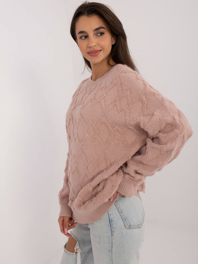 Brudnoróżowy sweter oversize we wzory