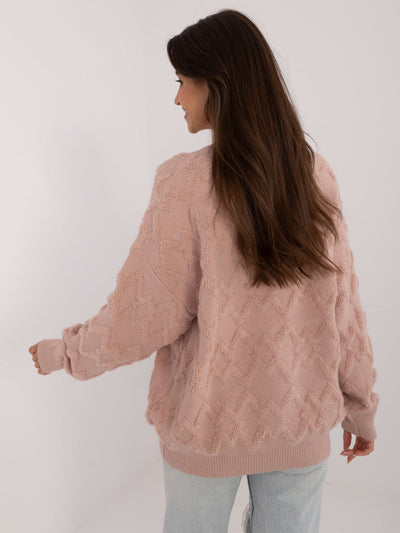 Brudnoróżowy sweter oversize we wzory