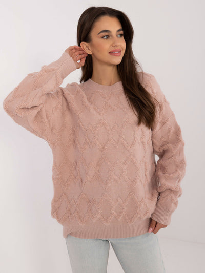 Brudnoróżowy sweter oversize we wzory