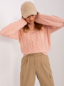 Brzoskwiniowy dzianinowy sweter w warkocze