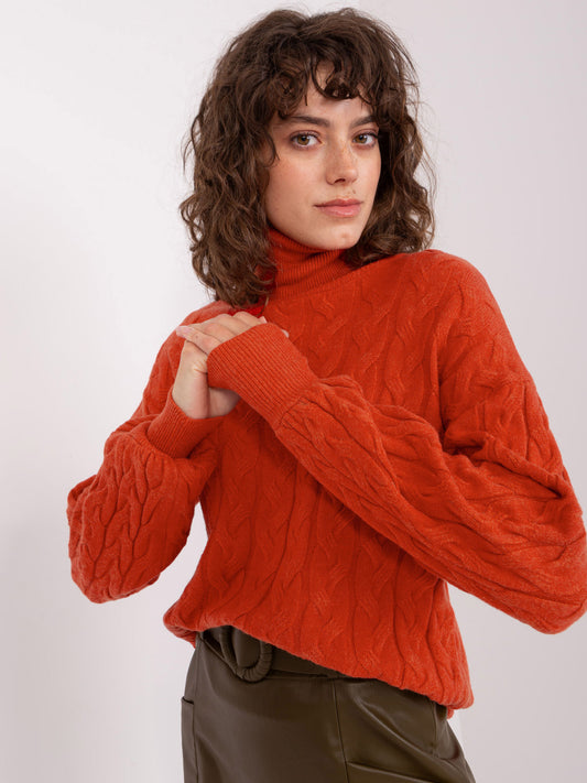 Pomarańczowy sweter golf z warkoczami