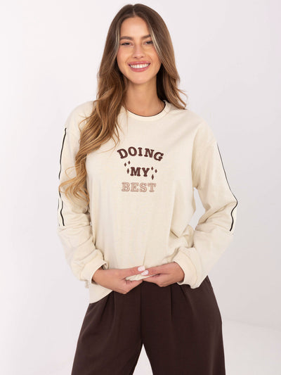 Jasnobeżowa bluza oversize z naszywką