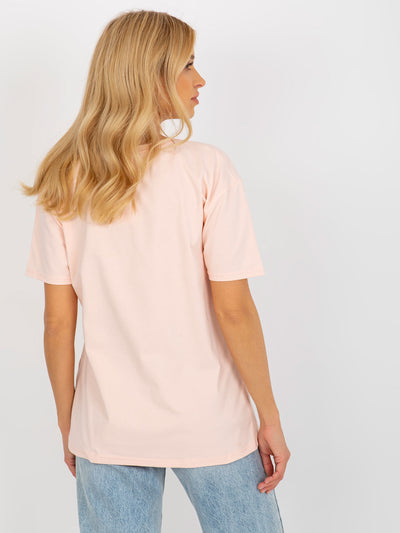 Jasnobrzoskwiniowy damski luźny t-shirt z nadrukiem