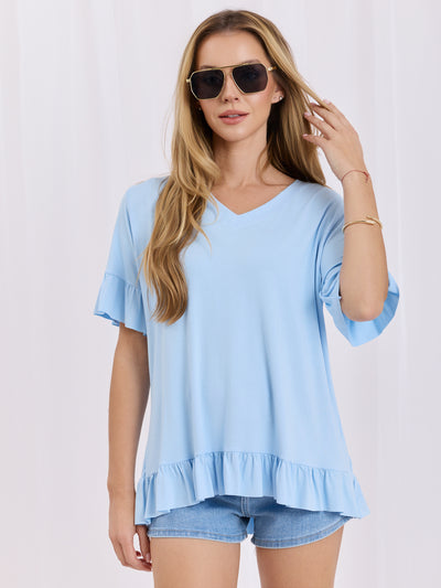 Jasnoniebieska bluzka oversize z falbankami