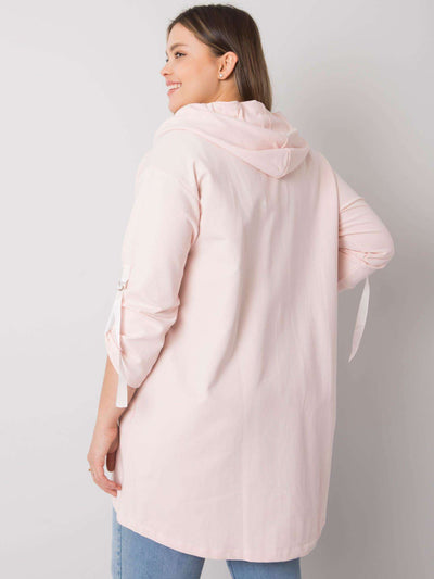 Jasnoróżowa bluza plus size z kapturem i aplikacjami