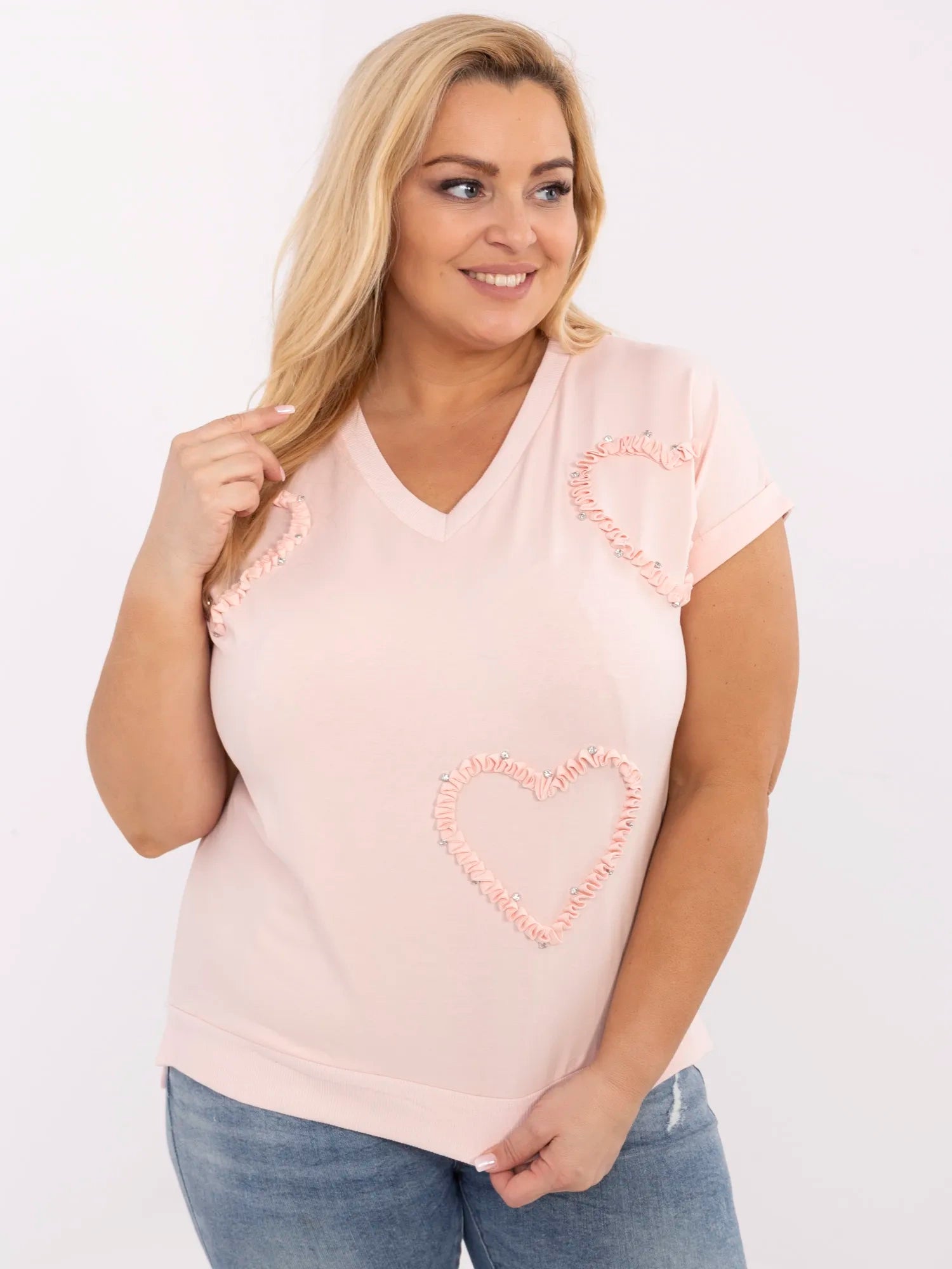 Jasnoróżowa bluzka plus size z aplikacjami