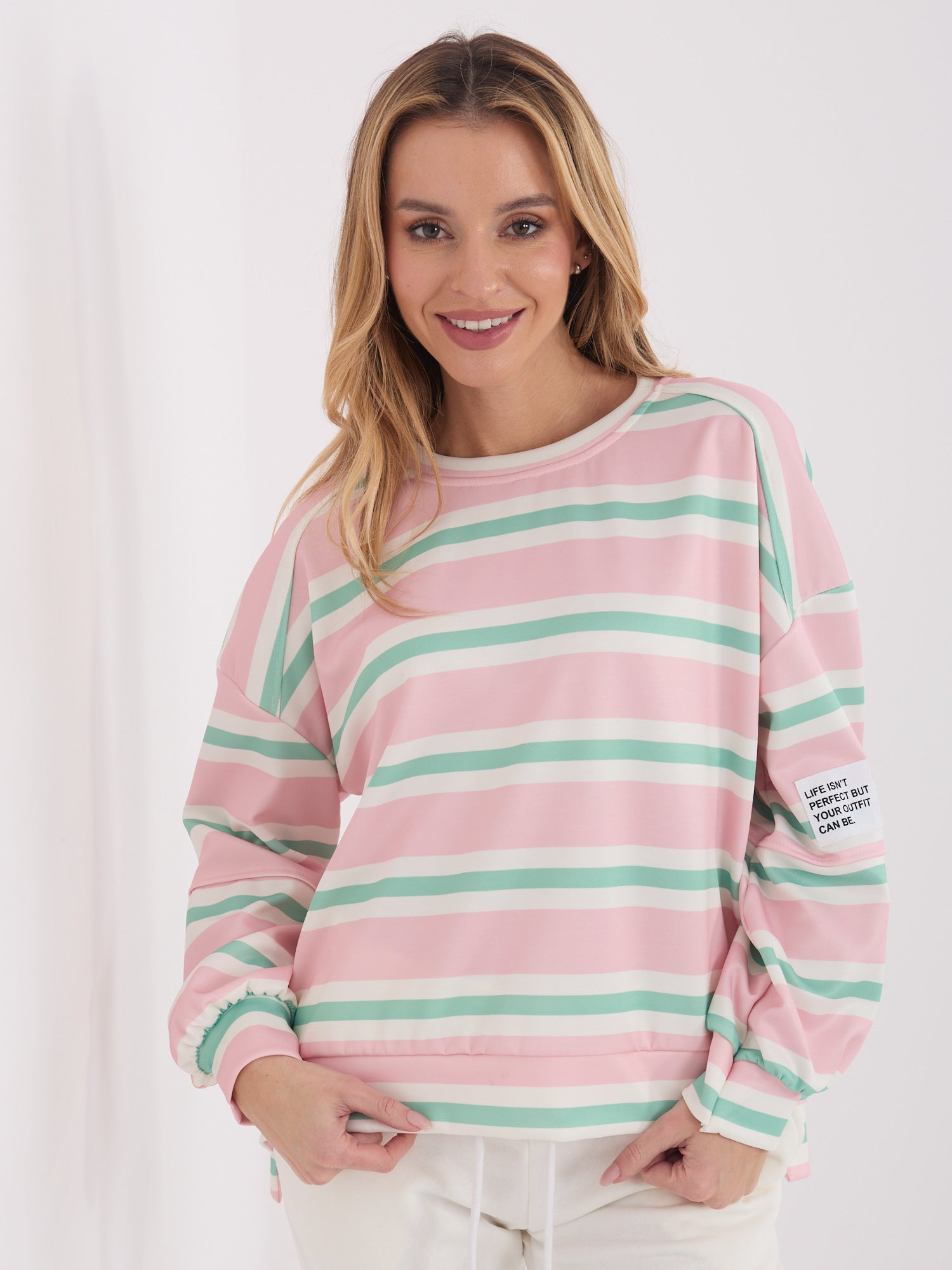Jasnoróżowa damska bluza oversize w paski