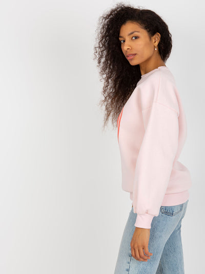Jasnoróżowa dresowa bluza oversize z nadrukiem
