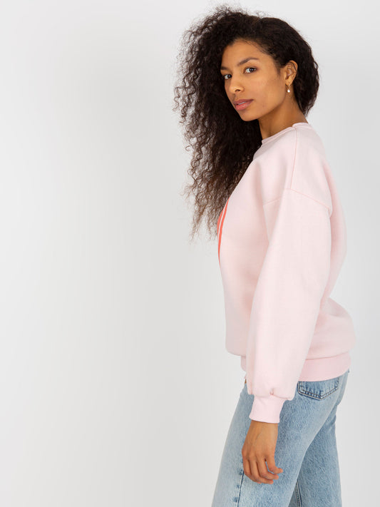 Jasnoróżowa dresowa bluza oversize z nadrukiem