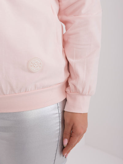 Jasnoróżowa bluzka plus size z długim rękawem