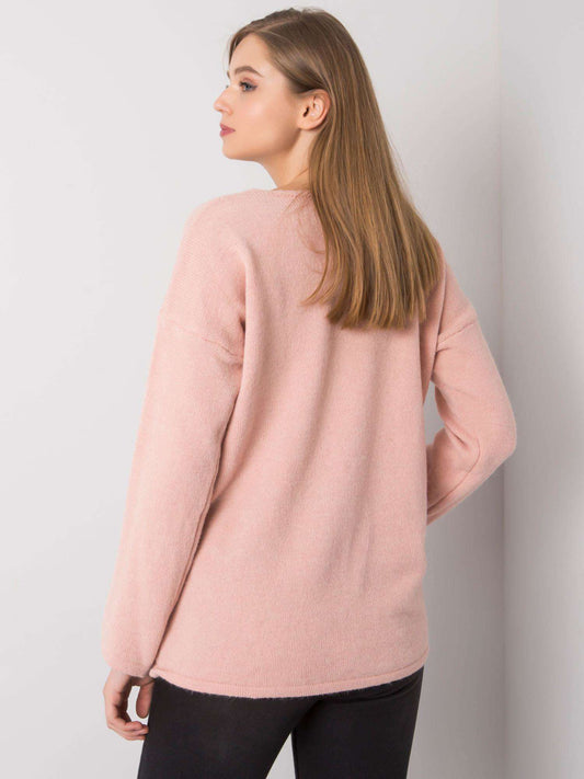 Jasnoróżowy sweter oversize