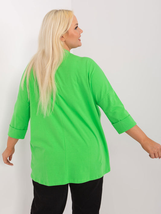Jasnozielona luźna bluzka plus size z kieszenią