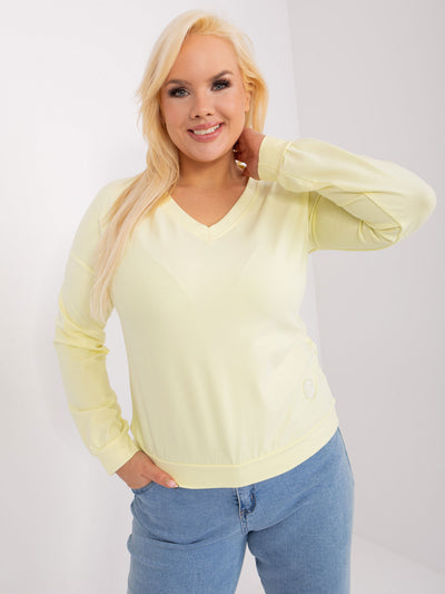 Jasnożółta damska bluzka plus size z naszywką