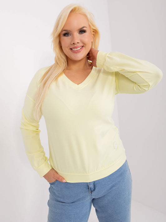 Jasnożółta damska bluzka plus size z naszywką