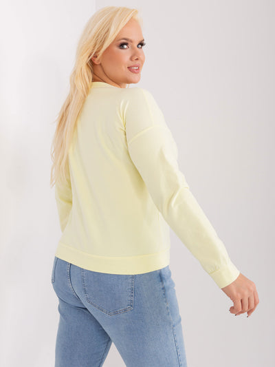 Jasnożółta damska bluzka plus size z naszywką