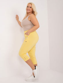 Jasnożółte spodnie rybaczki plus size z kieszeniami