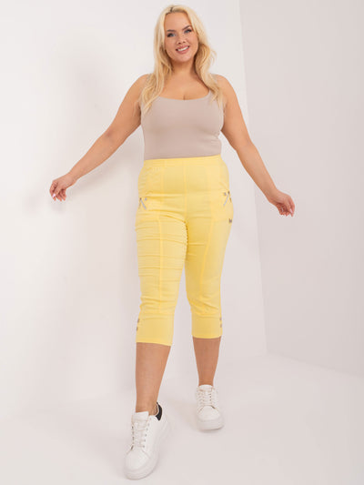 Jasnożółte spodnie rybaczki plus size z kieszeniami