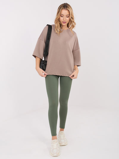 Khaki prążkowane legginsy z napisem z tyłu