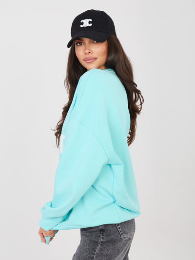 Miętowa bluza oversize z wypukłym napisem