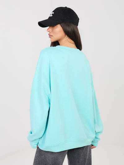 Miętowa bluza oversize z wypukłym napisem