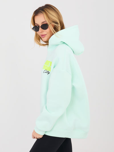 Miętowa damska bluza oversize z kapturem