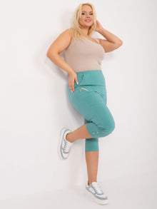 Miętowe spodnie 3/4 plus size z gumką w pasie