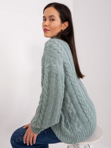 Miętowy sweter z warkoczami i ściągaczami