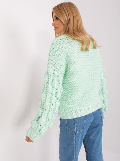 Miętowy sweter oversize z grubym splotem