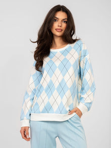 Pastelowa niebieska bluza w geometryczne wzory