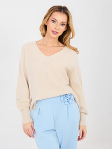 Pastelowy beżowy sweter oversize z dekoltem V