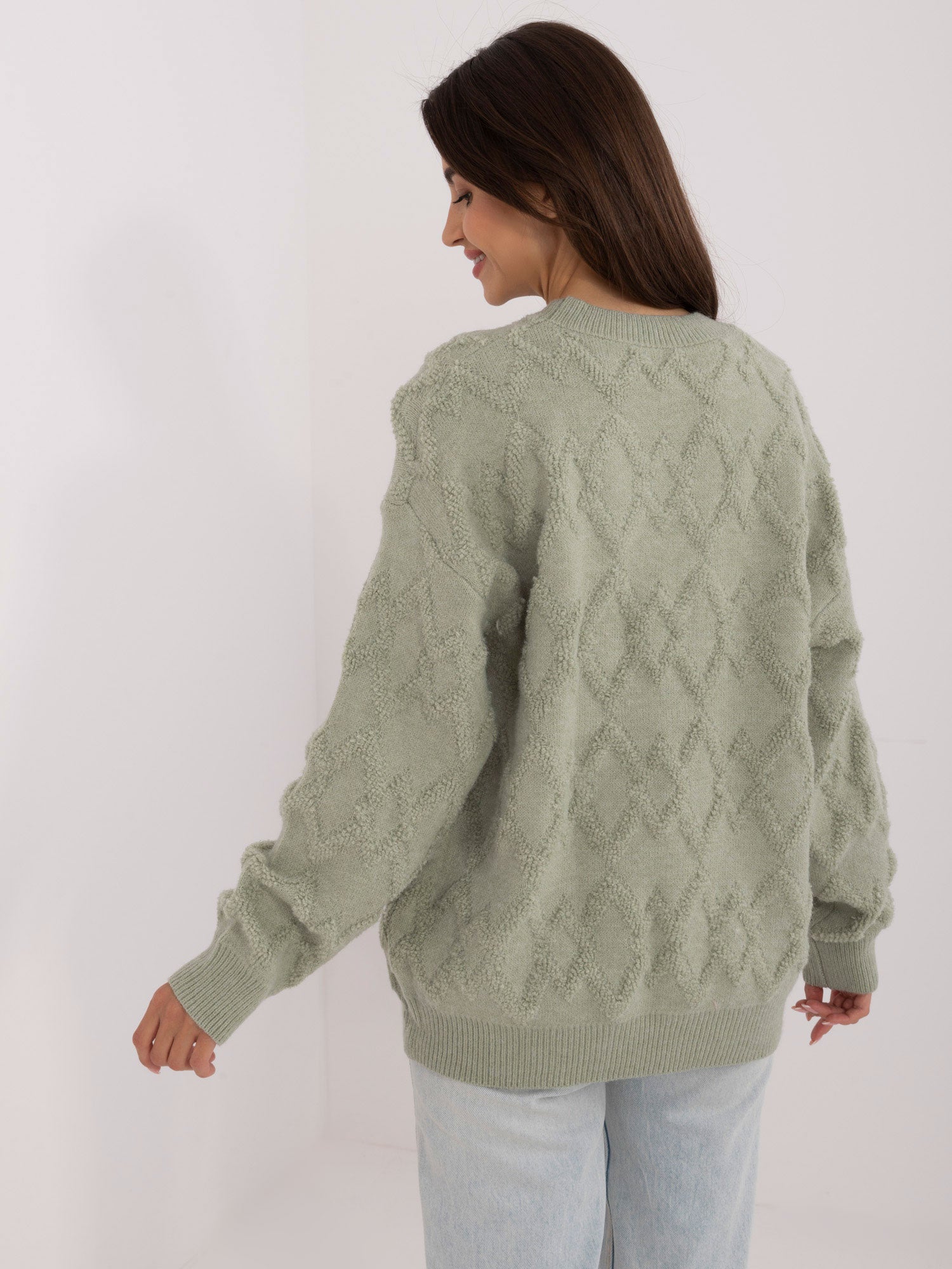 Pistacjowy damski sweter o kroju oversize