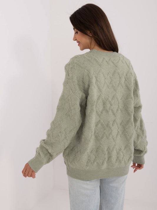 Pistacjowy damski sweter o kroju oversize