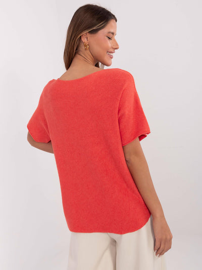 Pomarańczowy sweter oversize z krótkim rękawem
