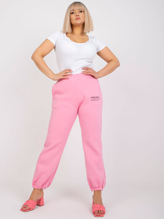Różowe dresowe spodnie plus size