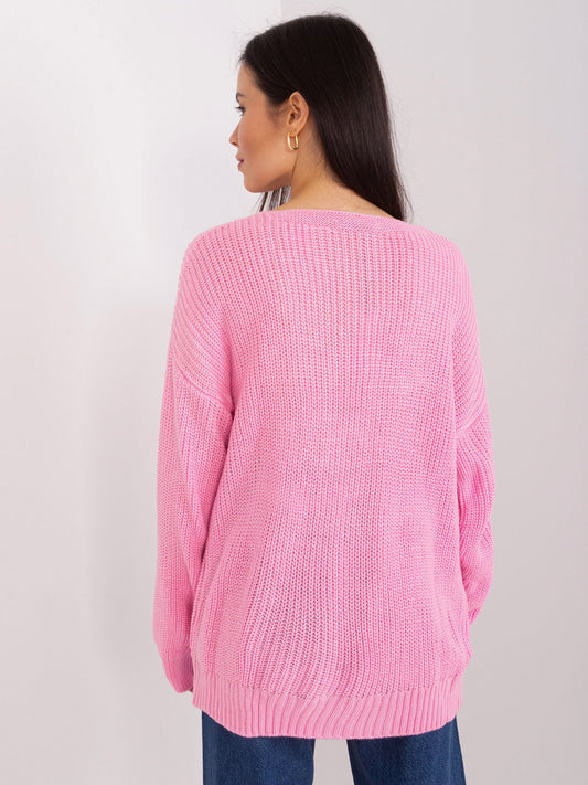 Różowy sweter klasyczny z warkoczami