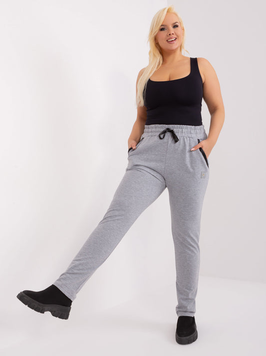 Szare melanżowe spodnie plus size z naszywką