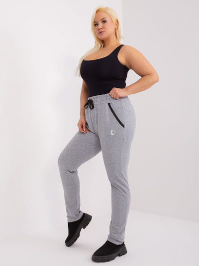 Szare melanżowe spodnie plus size z naszywką
